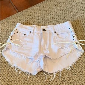 white oneteaspoon jean shorts side ties distressed